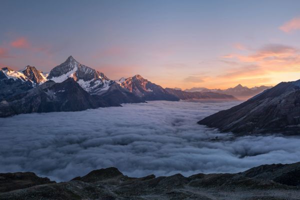 Alpine peaks above clouds